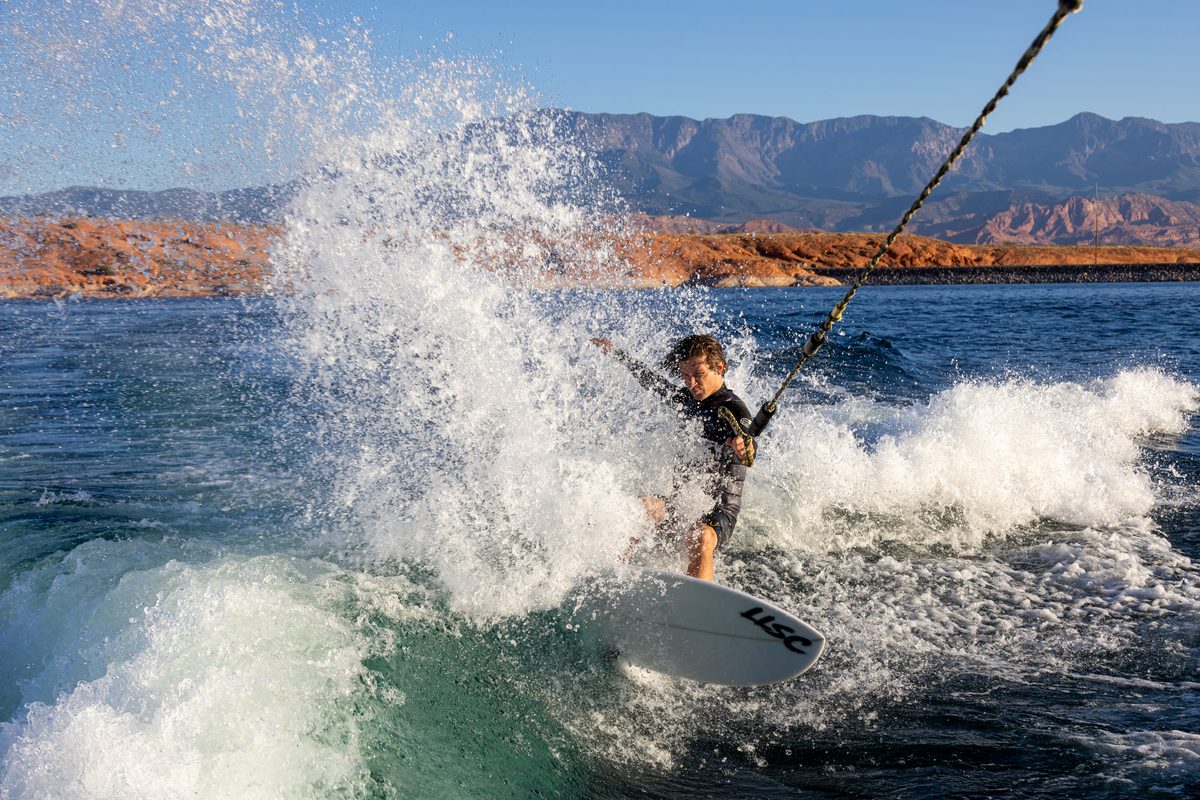sandhollowstatepark man wakesurfing behind a boat.