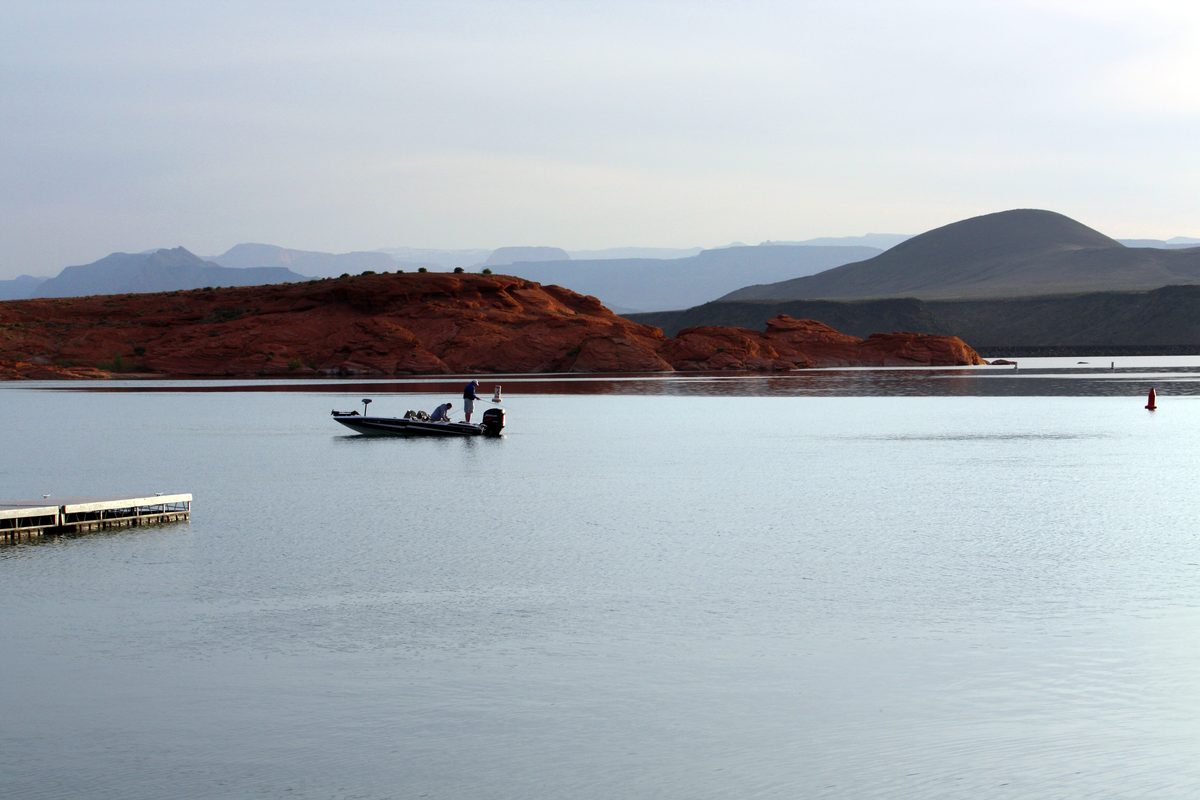 sand hollow state park, two men on a boal fishing 