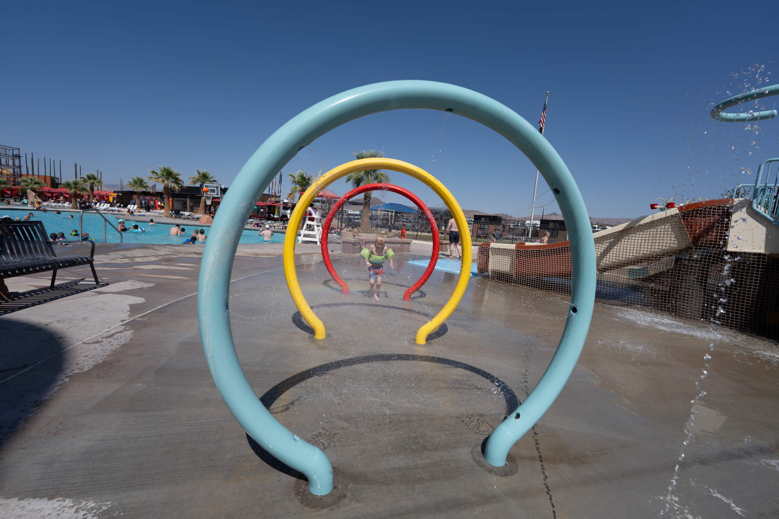 Child playing in splash pad. 